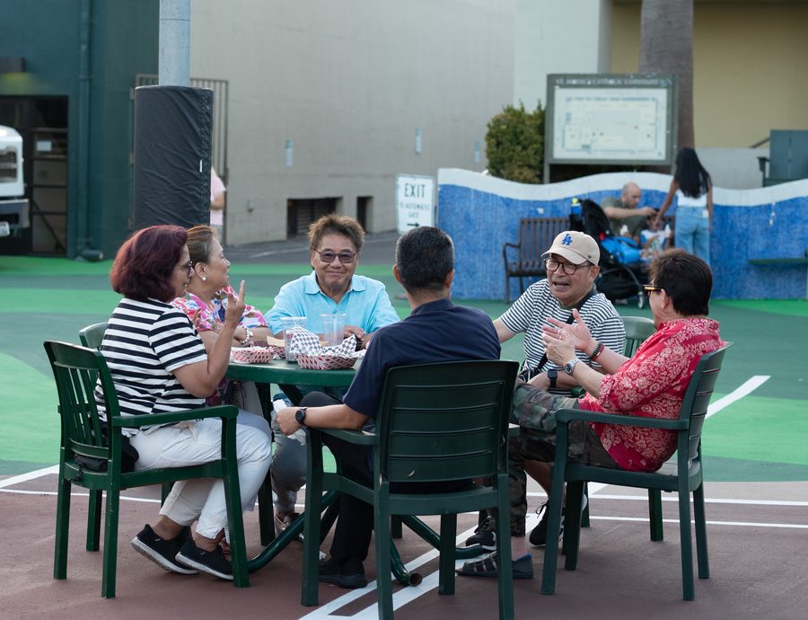 Parishioners around a table at Food Truck Night